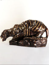 Brass tiger drinking water sculpture, side view with detailed stripes and head
