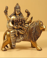 Brass Navadurga idol on horse, deity seated with four arms holding ornaments