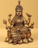 Brass Navadurga seated deity idol with multiple arms, patterned attire and crown
