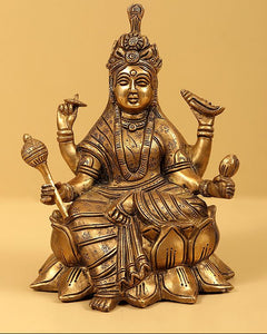 Brass Navadurga seated deity idol with multiple arms, patterned attire and crown