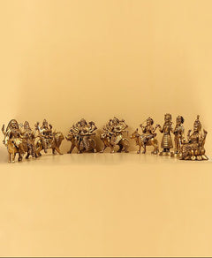 Brass Navadurga idol set with nine figures holding weapons, 9.25 inches tall