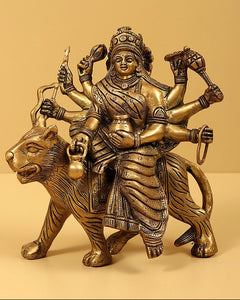 Brass Navadurga idol riding bull, multi-armed pose with detailed headgear