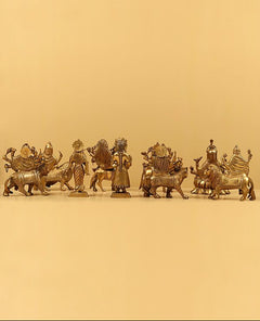 Brass Navadurga idol group with nine seated and standing figures, 9.25 inches tall