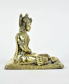 Brass Hanumanji idol angled side view, raised profile, draped garments, detailed base