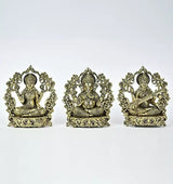 Small brass Lakshmi, Ganesha, and Saraswati seated statues, ornate arch back, 10 cm