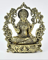 Brass seated deity statue with ornate halo, raised hand, detailed robe and jewelry