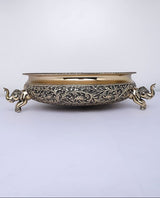 Brass urli bowl with elephant figurine handles and detailed scroll engraving
