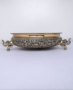 Brass urli bowl with elephant figurine handles and detailed scroll engraving