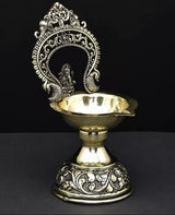 Gold and silver-tone brass diya base with Ganesha idol and sculpted design