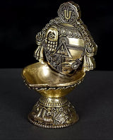 Brass conch diya with Tirupati Balaji idol, 4 in, angled view, textured stand