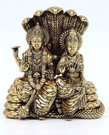 Brass Lakshmi-Narayana statue, seated on Sheshnag, ornate crowns and jewelry