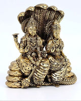 Brass Lakshmi-Narayana figurine seated on Sheshnag, detailed robes and ornaments