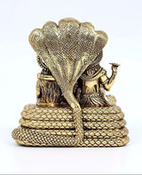 Brass Sheshnag-seated statue, back view with textured coils and raised cobra hood