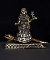 Brass Ganga goddess idol seated on Makara, raised trident flame and ornate jewelry