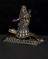Brass Ganga goddess idol front view, Makara beside base and intricate etched patterns