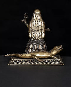 Brass Ganga goddess idol back view on Makara base, flame trident symbol visible