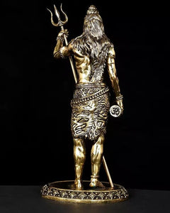 Side view of Lord Shiva brass idol with long hair, trident, and decorative waist cloth