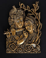 Brass Radha-Krishna wall hanging idol with ornate crowns and floral detailing