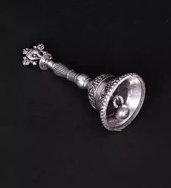 Brass conch bell side view with silver plating, embossed cup and decorative handle