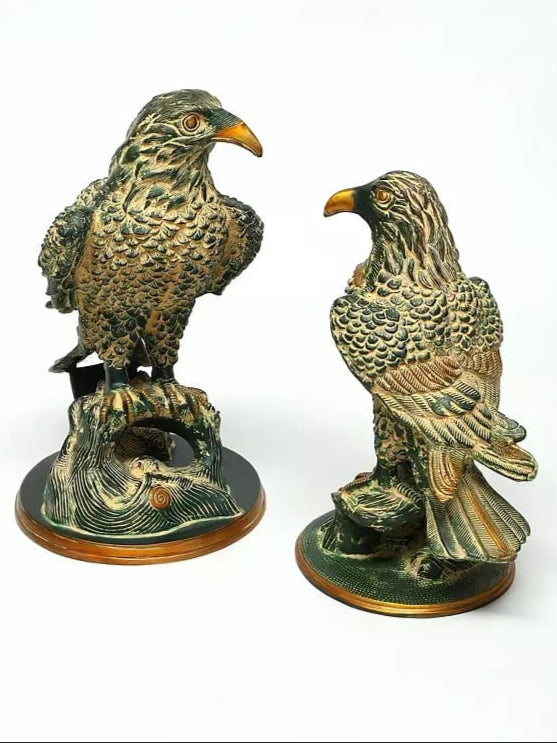 Brass pair of eagle statues, 15 in: one bird facing left on a circular base