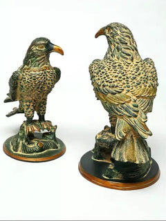 Brass eagle statues, 15 in: side views with carved feathers and sculpted wings