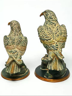 Brass pair of eagle statues, 15 in: front views highlighting ornate feather embossing