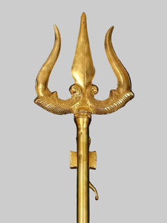Brass trishul crown with three curved prongs and detailed central figure