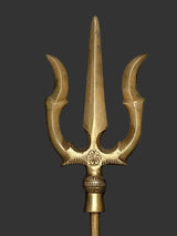 Brass trishul trident ornament with three curved prongs and carved base band.