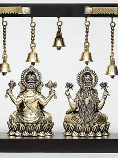Detailed Lakshmi and Ganesha faces with bell chains and ornate medallions