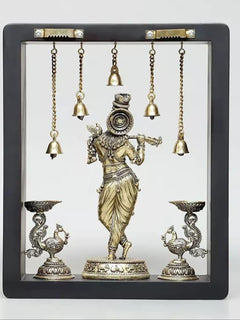 Top bar with metal studs and hooks above hanging bell chains for Lord Krishna wall hanging