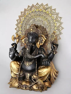 Brass Ganesha statue seated, black-and-gold details, intricate mandala back