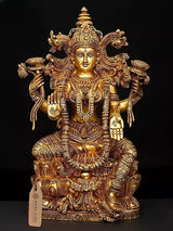 Brass Lakshmi statue, 15 in tall, seated with ornate crown and carved jewelry