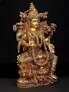 Brass Lakshmi statue, three-quarter view, seated with intricate arm detailing and jewelry