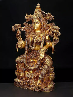 Brass Lakshmi goddess statue, seated pose, detailed headdress and gold-toned ornaments