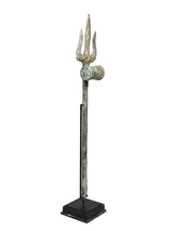 Brass trishul spear ornament on square base, three prongs with round emblem