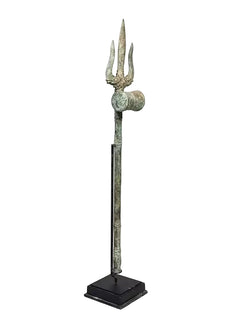 Brass trishul spear ornament on square base, three prongs with round emblem
