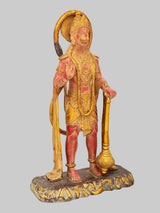 Brass Lord Hanuman standing statue holding staff, side view, gold and red detailing
