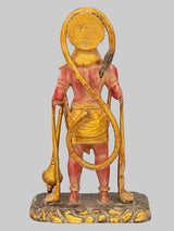 Brass Lord Hanuman standing statue from behind, gold staff and red body, textured base