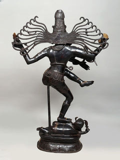 Dancing Shiva Nataraja brass sculpture, side view with long halo arms on base