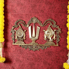 Brass Shankh Chakra Namah wall hanging with ornate arch and central U motif