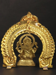 Brass Lord Ganesha statue with arch—front view, brass-toned raised ornaments
