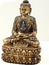 Brass small Buddha idol, seated cross-legged in dhyana mudra with detailed base
