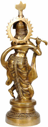 Brass Murli Krishna statue from side, raised flute hand, detailed carved garments