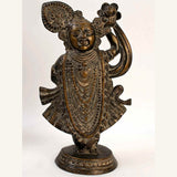 Antique brass Shri Krishna as Shrinathji statue, ornate jewelry, raised arm