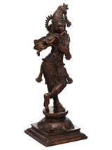 Krishna flute figurine in dark brass with raised ornaments, 23 in