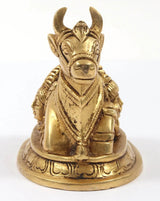 Brass Nandi figurine with Shiva-Parvati carving, ornate detailing and raised horns