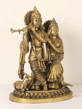 AONA brass Radha and Krishna figurine with flute, standing beside cow, detailed headdress