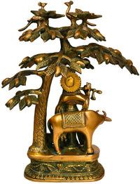 Brass Krishna playing flute statue with cow and mango tree, ornate detailing and base