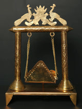Brass jhoola with lotus and peacock top, detailed columns, hanging cradle swing, 28 cm