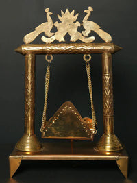 Brass jhoola with lotus and peacock top, detailed columns, hanging cradle swing, 28 cm